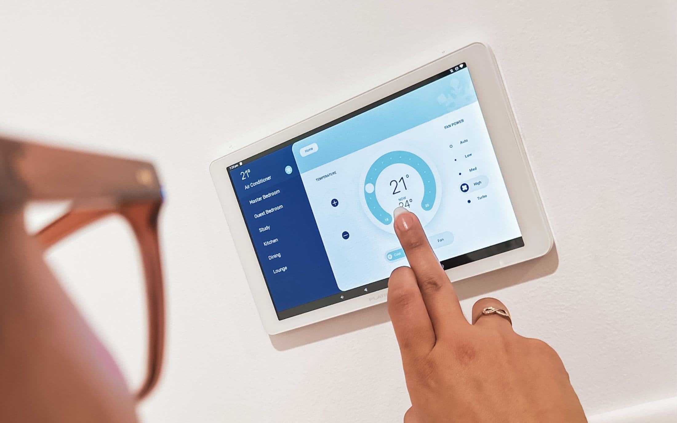 A user interacting with the Platinum Elite air conditioner controller